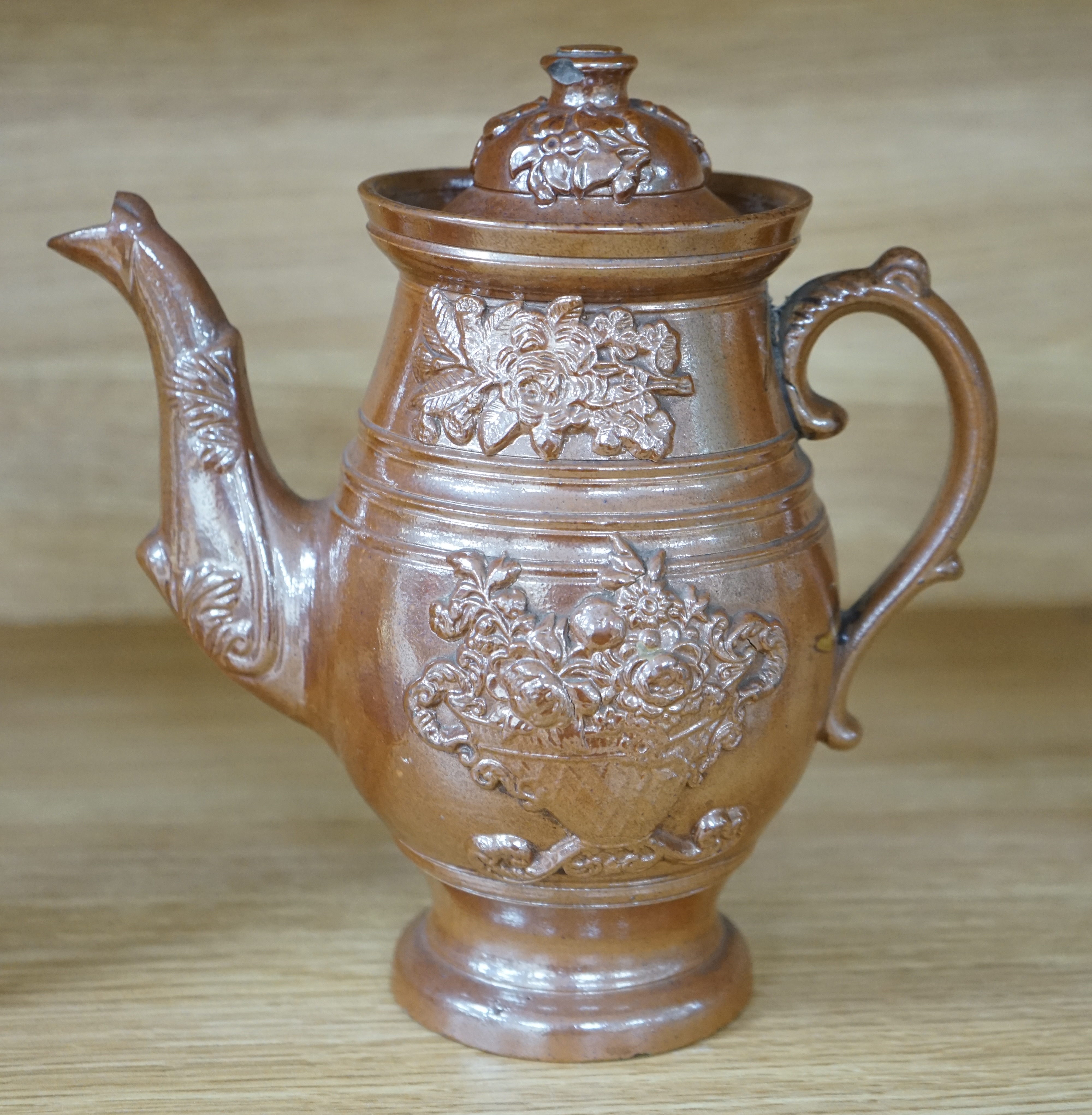 A Derbyshire salt-glaze coffee pot, 21cm high. Condition - fair, two significant chips to lid and other minor chipping.